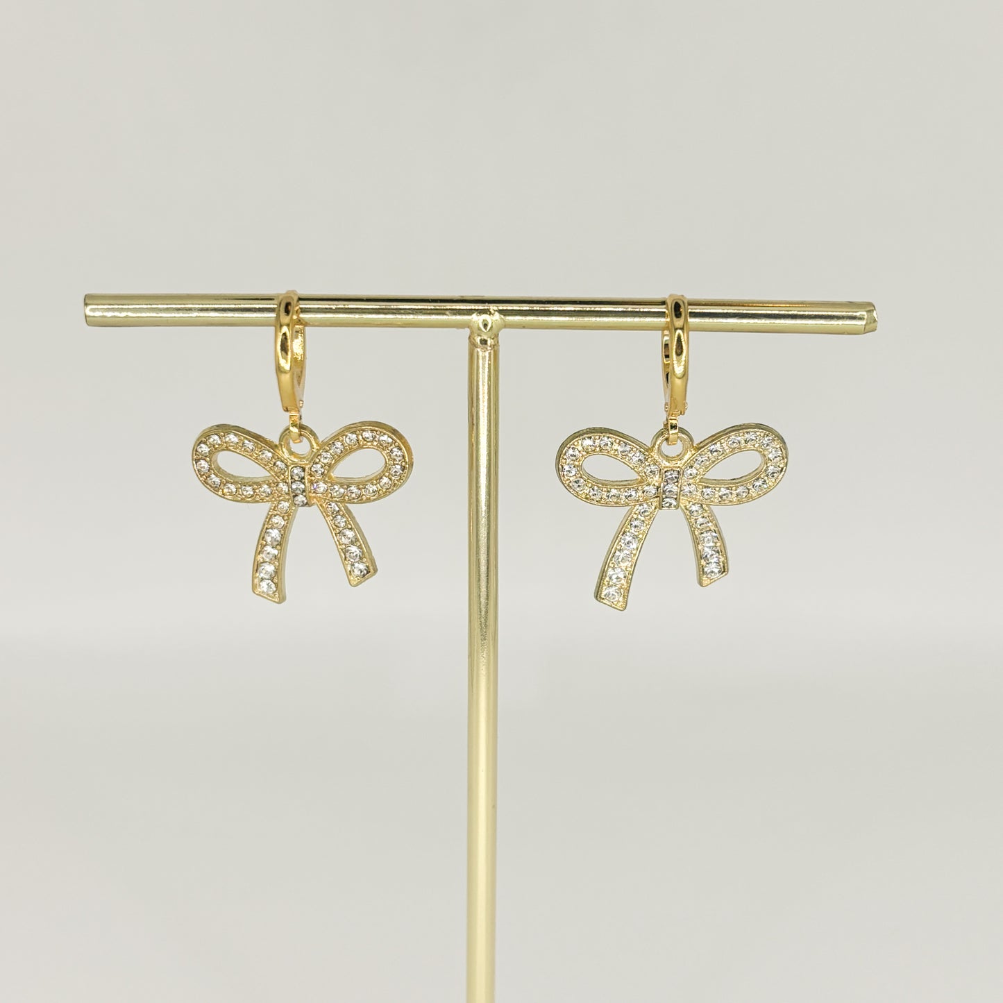 gold sparkle bow earrings
