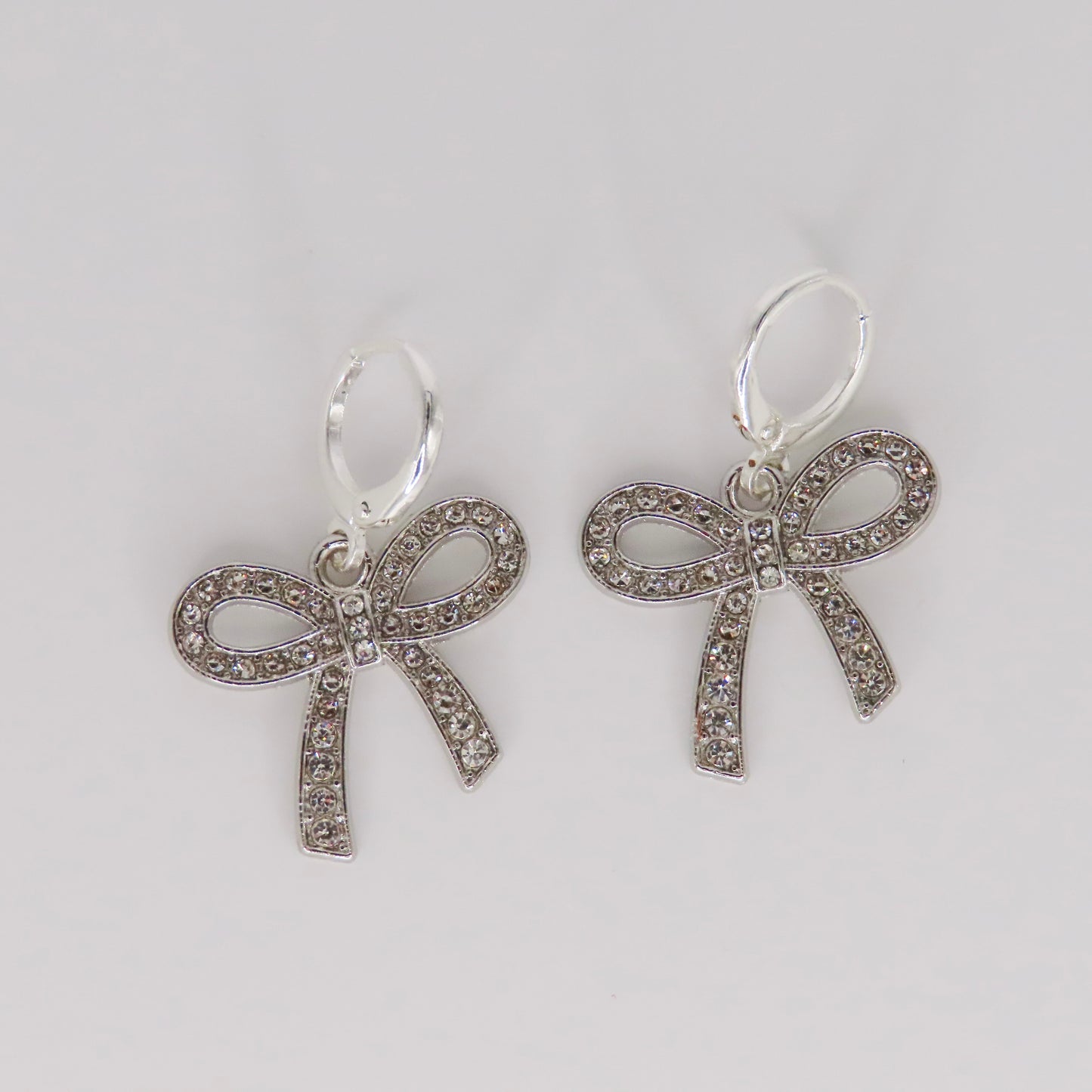 silver glimmer bow earrings