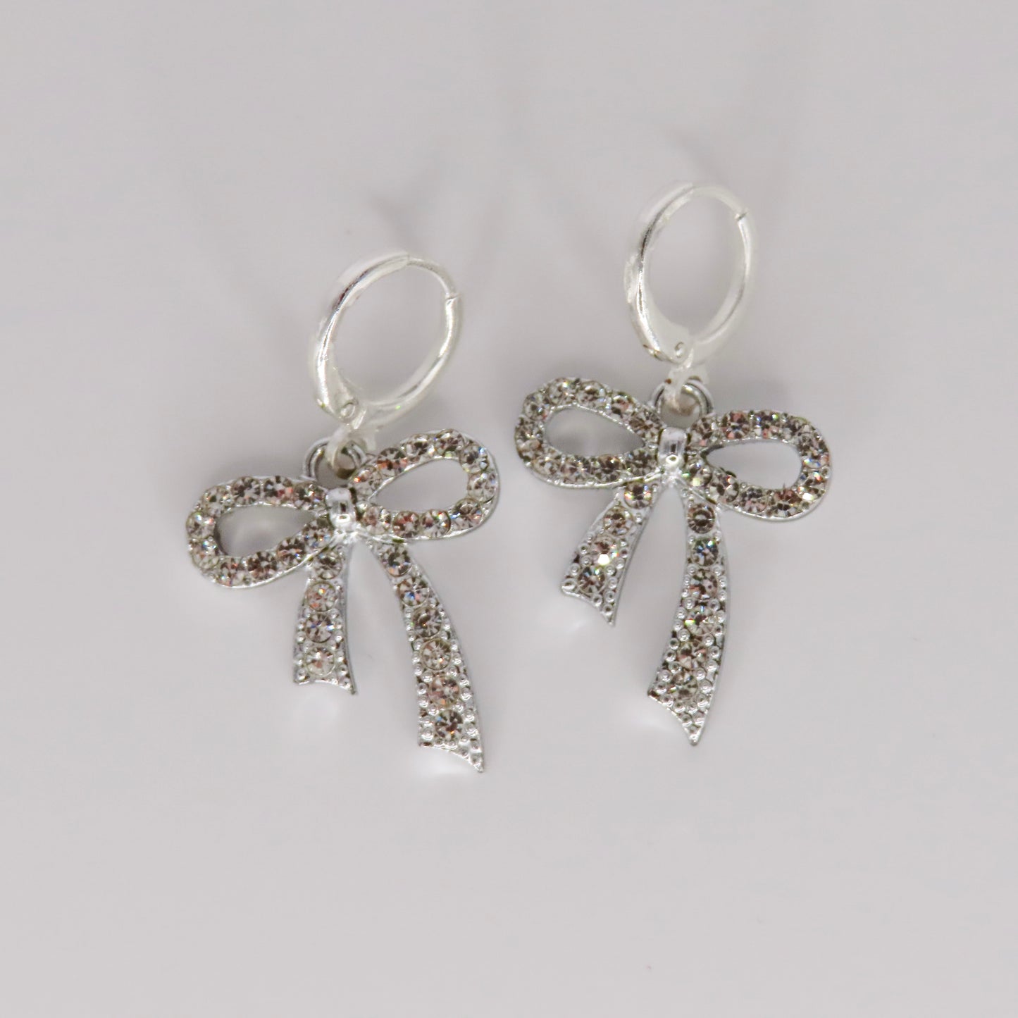 silver glitz bow earrings